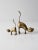 This is a pair of mid-century brass cat figurines. Stretching their backs, the cat and kitten figurines feature clean,...