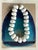 Signed Kenneth Jay Lane statement necklace with bold white beading. Lane began his career designing at Dior before...