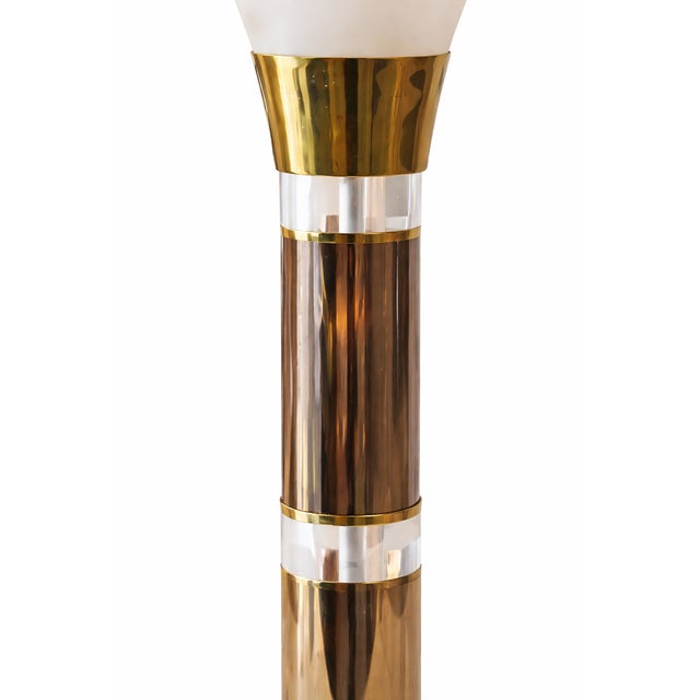 Elegant Art Deco–style table lamps featuring flared frosted glass shades, polished brass columns, and clear lucite accents...