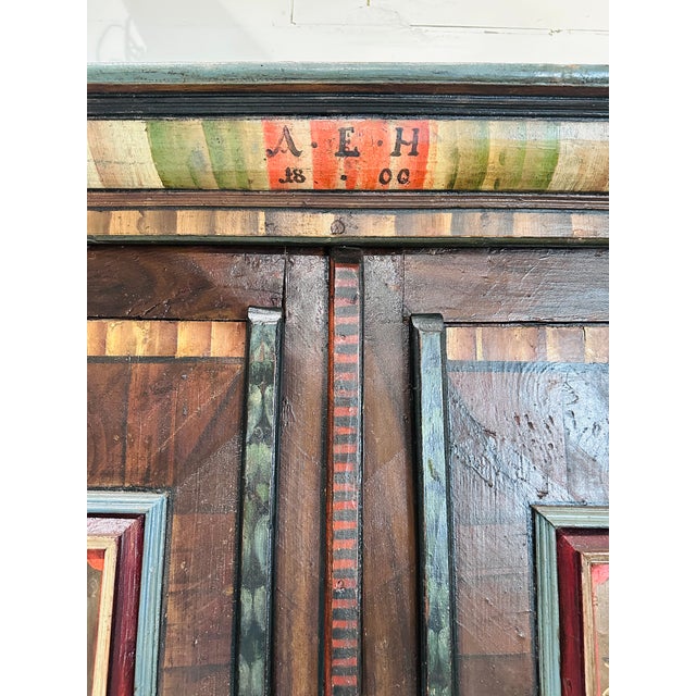 Antique Folk Art Armoire Bridal Cabinet. Dated 1800. Handmade iron hinges. Colorful painted motifs.