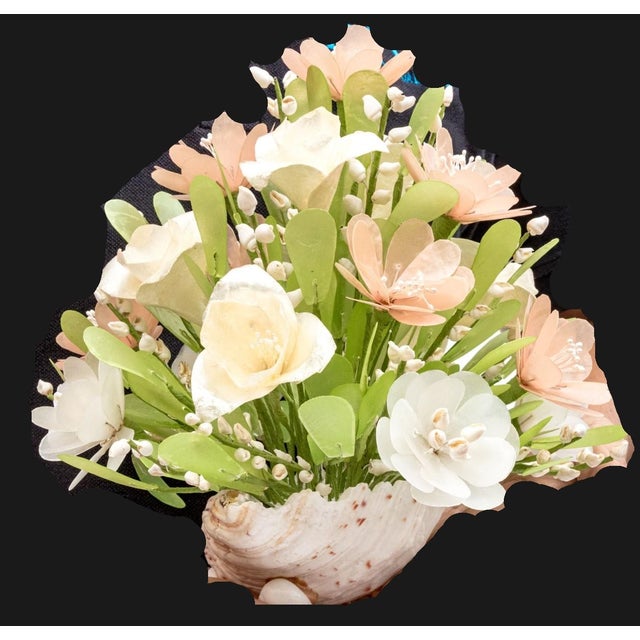 A delightful vintage capiz shell floral arrangement in the Filipino folk art tradition — hand-crafted flowers, leaves, and...