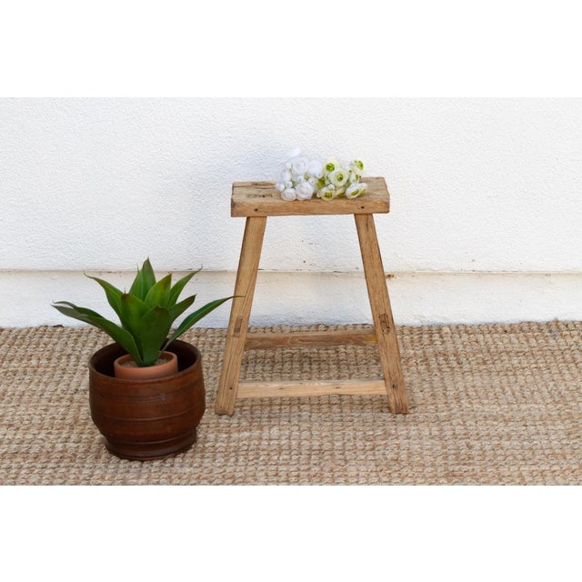 Full of age and character, this farmhouse style joint stool has a weathered look. This antique Asian stool has a stretcher...