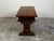 An Italian walnut table from the early 19th century, with carved motifs and two drawers. Created in Italy during the early...