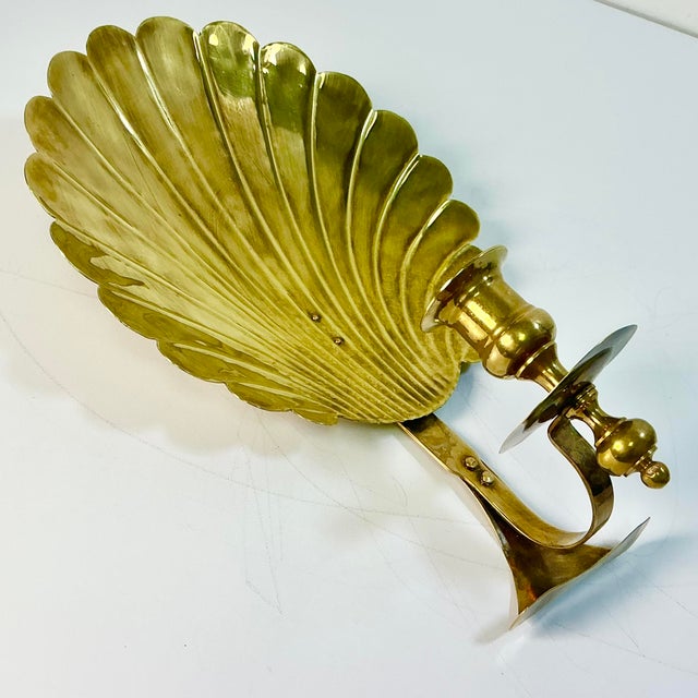 This is a lovely vintage brass Candleholder Sconce. It's from the 1970s and is large at almost a foot tall. The brass...