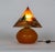 A hand-crafted Czechoslovakian glass table lamp with a spherical base and cone-shaped shade. The shade has a hand-painted...