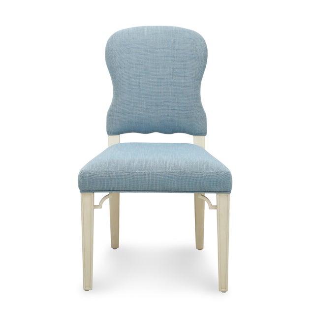 This comfortable, upholstered saddle seat dining chair comes ready-to-ship in two different finish/upholstery...