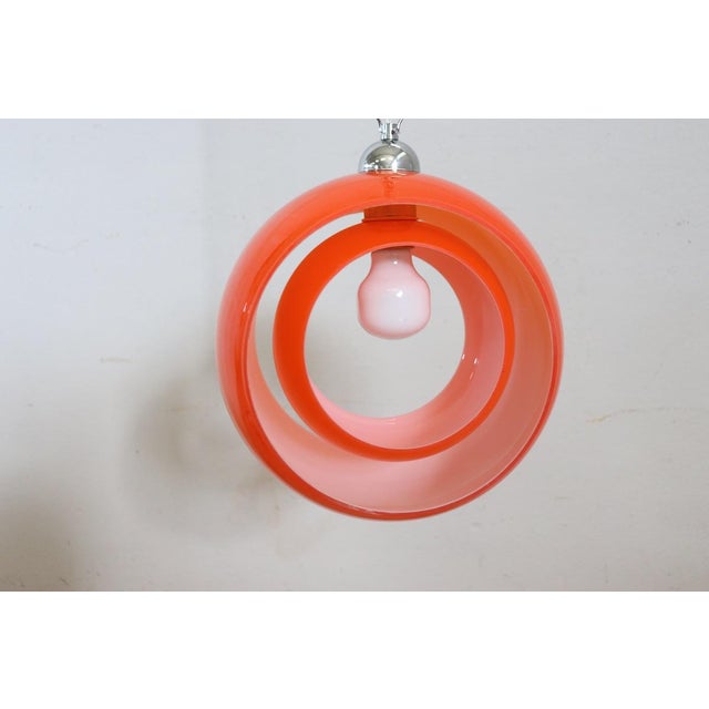 Introducing this ceiling lamp Italian design of the 60s. Made of fine Murano glass, orange on the outside and white on the...