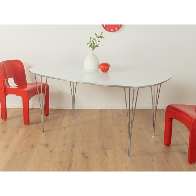 B612 SUPERELLIPSE dining table from the 1960s by Piet Hein & Bruno Mathsson for Fritz Hansen. High-quality matte steel...