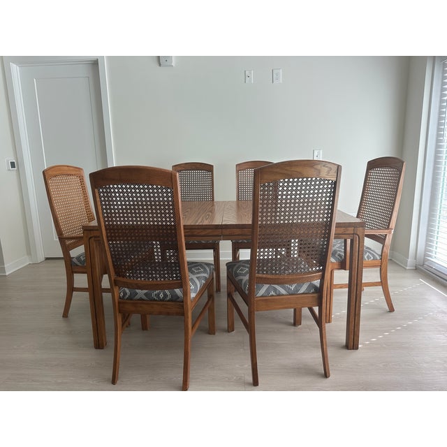 Beautiful vintage 1980s Keller Furniture Company dining set featuring six original arched cane-back chairs and an...
