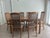 Beautiful vintage 1980s Keller Furniture Company dining set featuring six original arched cane-back chairs and an...