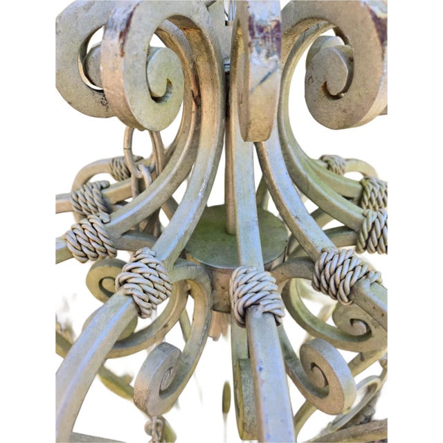 Monumental 48" Wrought Iron Chandelier with 12 lights This huge wrought iron chandelier is 48" high by 48" wide. It...
