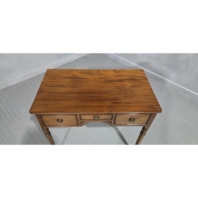 A super quality mahogany three drawer side table or writing table, in excellent original condition. 29" high 34.5" wide...