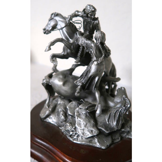 This is "The Rescue," a wonderfully detailed dramatic portrayal of an Indian brave rescuing an Indian woman. He reaches...