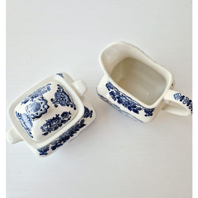 A highly collectible vintage ceramic sugar bowl and creamer set from the renowned "Royal Homes of Britain" series by Enoch...