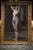 This is an antique French portrait painting of a nude woman. The piece was made in the early 20th century and comes framed.