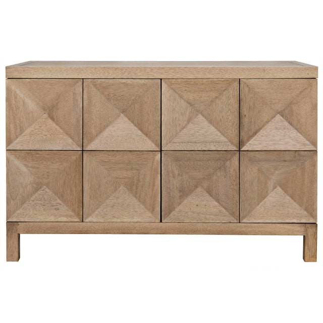 This handcrafted and beautifully finished walnut sideboard features two geometrically carved doors that open via hidden...