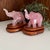 Beautiful pair of vintage hand-carved rose quartz elephants, each mounted on a custom wood base. The soft pink hues and...