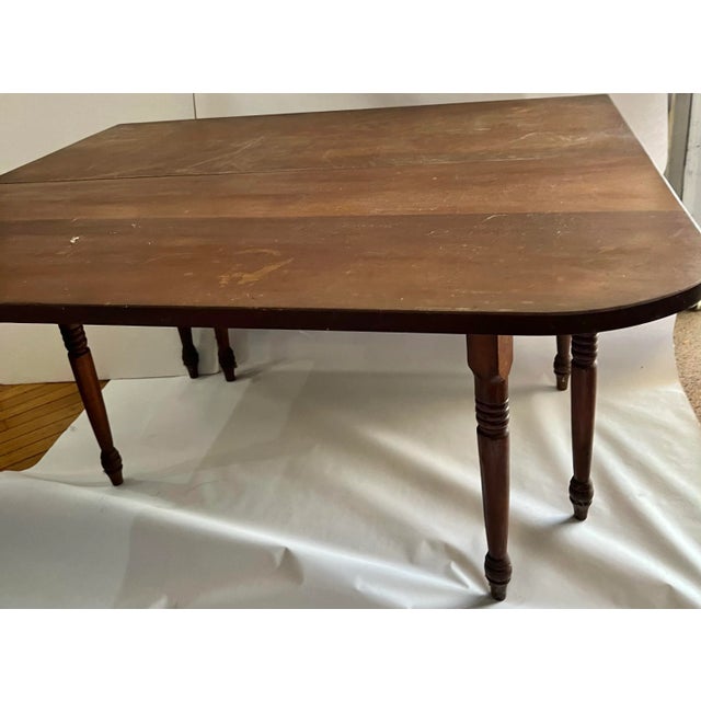 From a farm in Upstate New York a vintage mahogany gate legs table with drop leaves on the sides and spindled legs. When...