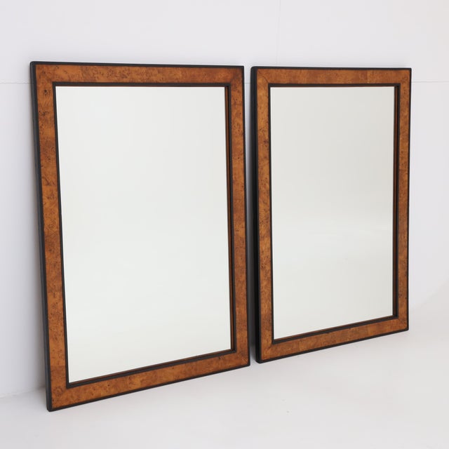 A fine pair of Biedermeier mirrors. Walnut veneer with ebonized edge profile. The inset mirrors have a slightly darkened,...
