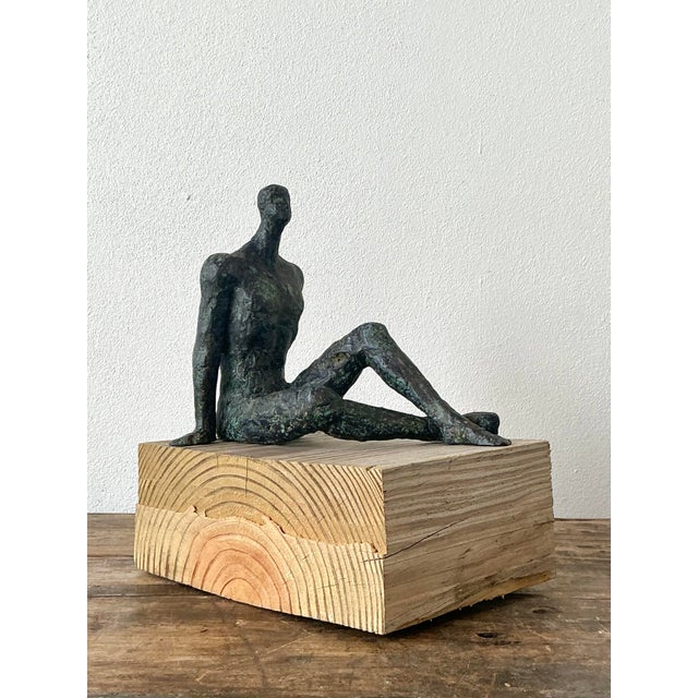 This evocative vintage sculpture captures the haunting, existentialist aesthetic famously pioneered by Alberto Giacometti....