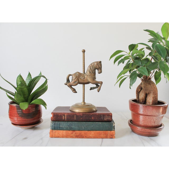Vintage solid brass carousel horse or merry-go-round horse figurine. No makers mark. Patina.