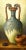 An original oil painting on canvas, from the 20th Century. Untitled, (Urn with Grapes). Signed "H Delff" to lower right....