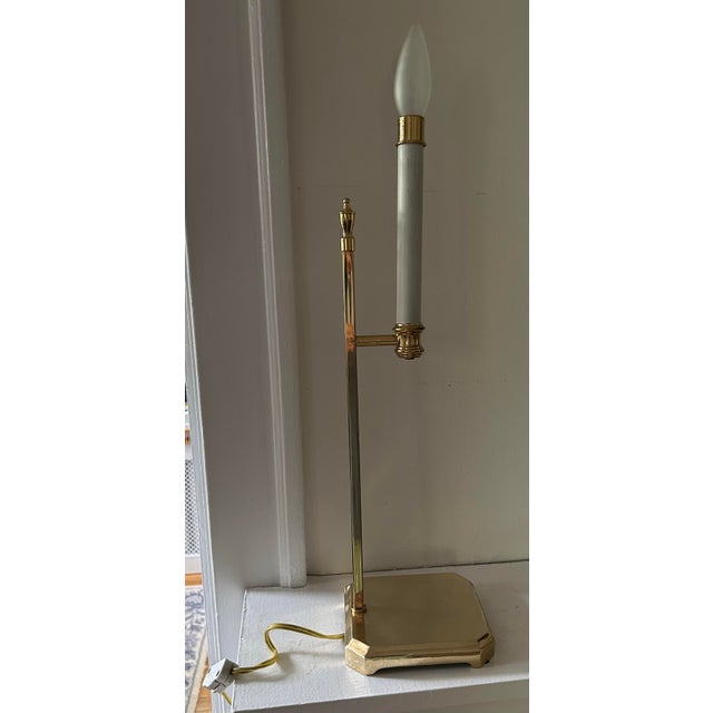 Vintage 1980's brass candlestick lamp with shade. Switch on cord. Has two settings dim and bright. 23" to top of shade,...