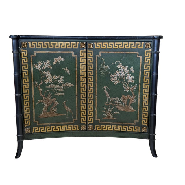 Elegant two-door Chinoiserie-inspired cabinet by the renowned John Widdicomb Company of Grand Rapids, Michigan. This...
