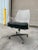 Mid Century circa 1960’s vintage lucite rolling desk chair on an aluminum and black base. Upholstery surface has peeled,...