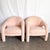 A striking pair of postmodern sculpted lounge chairs upholstered in a soft blush pink. Featuring bold, rounded silhouettes...