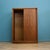 A mid-century Austinsuite wardrobe in teak, with a warm tone and attractive grain across the sliding doors. Clean, simple...