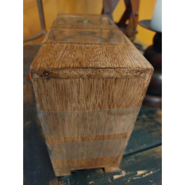 New. Beautiful ceramic decorated 9-drawer wood box. Storage drawers are ceramic in vivid Mexican colors held in wooden box...