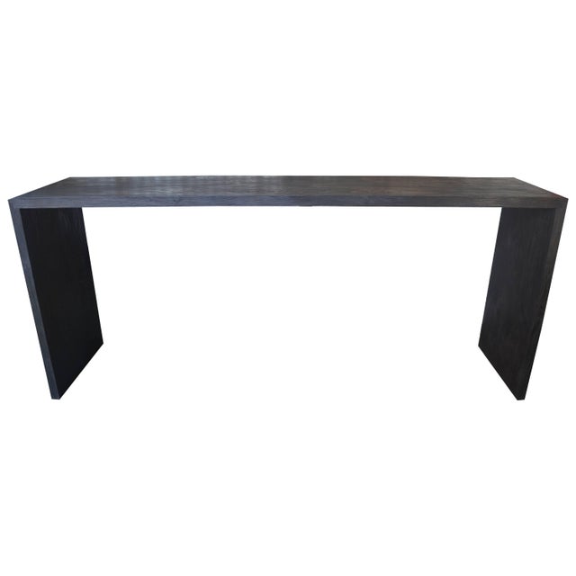 Solid reclaimed teak wood console table with dovetail detail. Burnt, sanded and sealed while still revealing the natural...