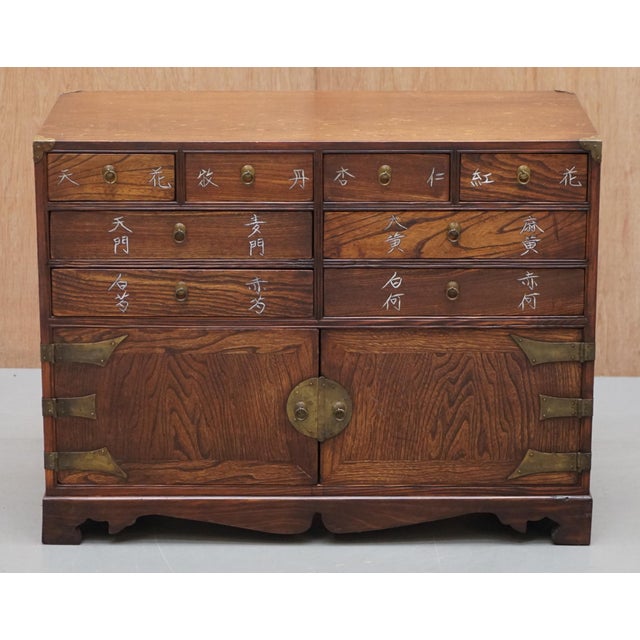 We are delighted to offer for sale this lovely small Apothecary Burl Elm Chinese chest of drawers with cupboard base A...