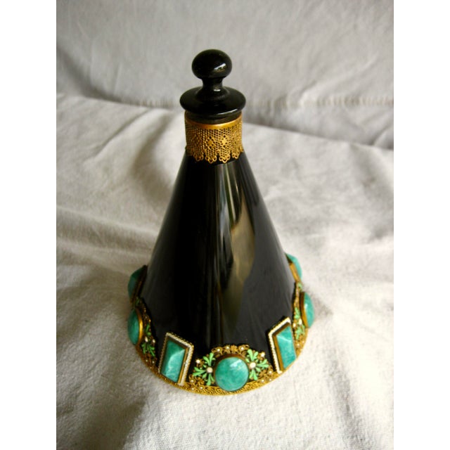 This stunning perfume bottle is more an art object than what it was made for , the incredible attention to details makes...