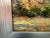 Brilliant color and light level up this otherwise traditional plein air painting. Signed on recto. Framed in silver-...