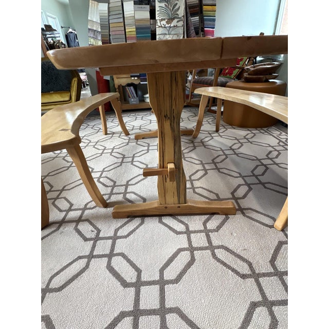 This breathtaking handcrafted live-edge dining table and matching bench set by the renowned artisan studio Harnett Wood...