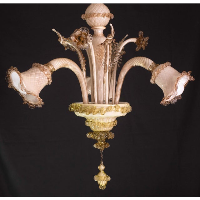 Pretty Murano chandelier, typical classic Venetian. Peculiar characteristic of being two-colored, the arms and leaves are...
