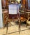 An exquisite French Louis XV style display cabinet featuring a beautifully crafted vitrine elevated on an elegant console...