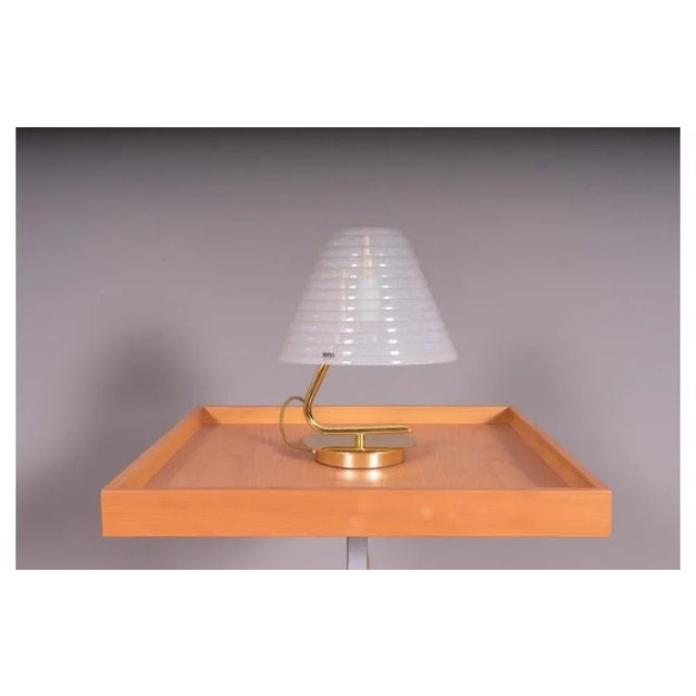 Small table lamp with golden base and satin glass shade. Measures: Height 30cm Width 22cm Depth 22cm. European Plug (up to...