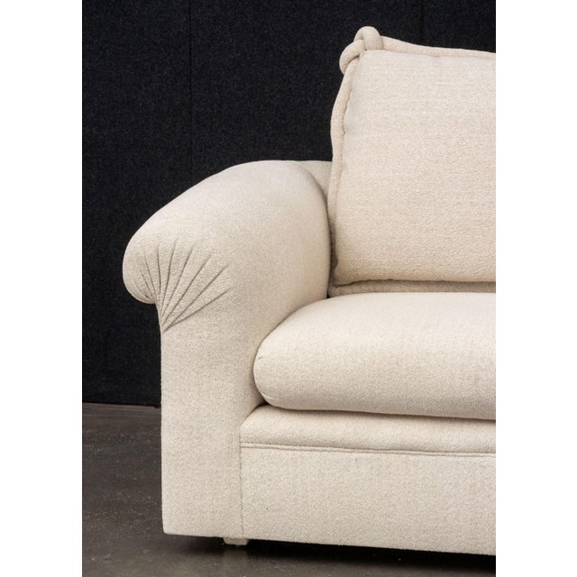 Modern Beige Fabric Upholstered Three-Seat Sofa, with three throw pillows. 28" H x 93" W x 46" D; seat: 20" H. Provenance:...