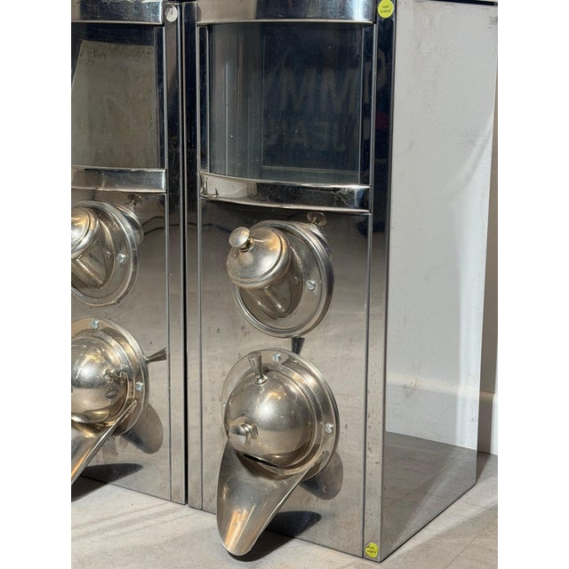 A striking set of four vintage industrial coffee silos, crafted in stainless steel with an unmistakable space-age...