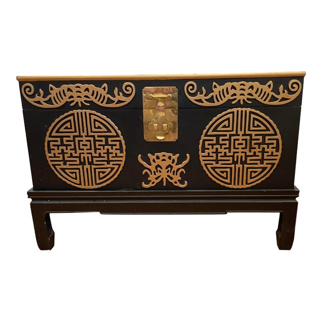 Vintage Mid Century Asian Carved Trunk on Stand With Brass Latch For Sale