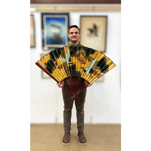 Monumental 70" Vintage Chinese Hand-Painted Gilt Wall Fan - "Cranes & Pine" A commanding and sophisticated example of mid-...