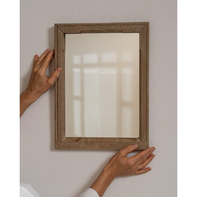 Cerused oak wall mirror in Weathered Whitewash. The weathered whitewash surface highlights simple rectangular molded...