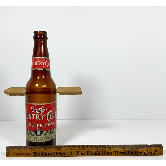 Folk Art Arrow Through Goetz Beer Bottle: Whimsical Display Piece For Sale - Image 9 of 10