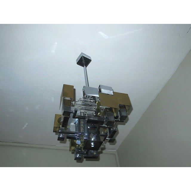 Impressive and rare Gaetano Sciolari Italian Modern chandelier in brass, glass and chromed metal, dating from the...