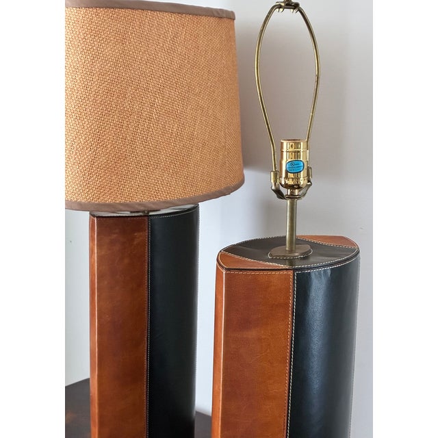 Offered is a striking pair of mid-20th-century modern table lamps featuring exceptional craftsmanship and masculine...