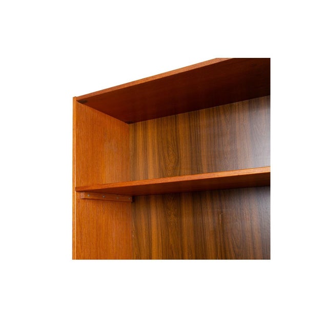 Fantastic mid-century teak, bookcase storage cabinet/hutch. This amazing vintage bookcase and storage cabinet features an...