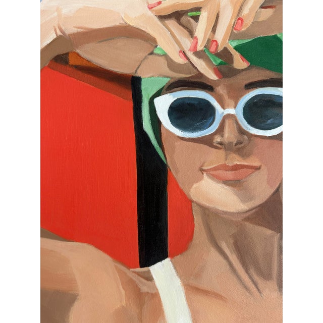 An array of primary colors! Shading her eyes from the sun with her hands and wearing her white sunnies, she exemplifies a...